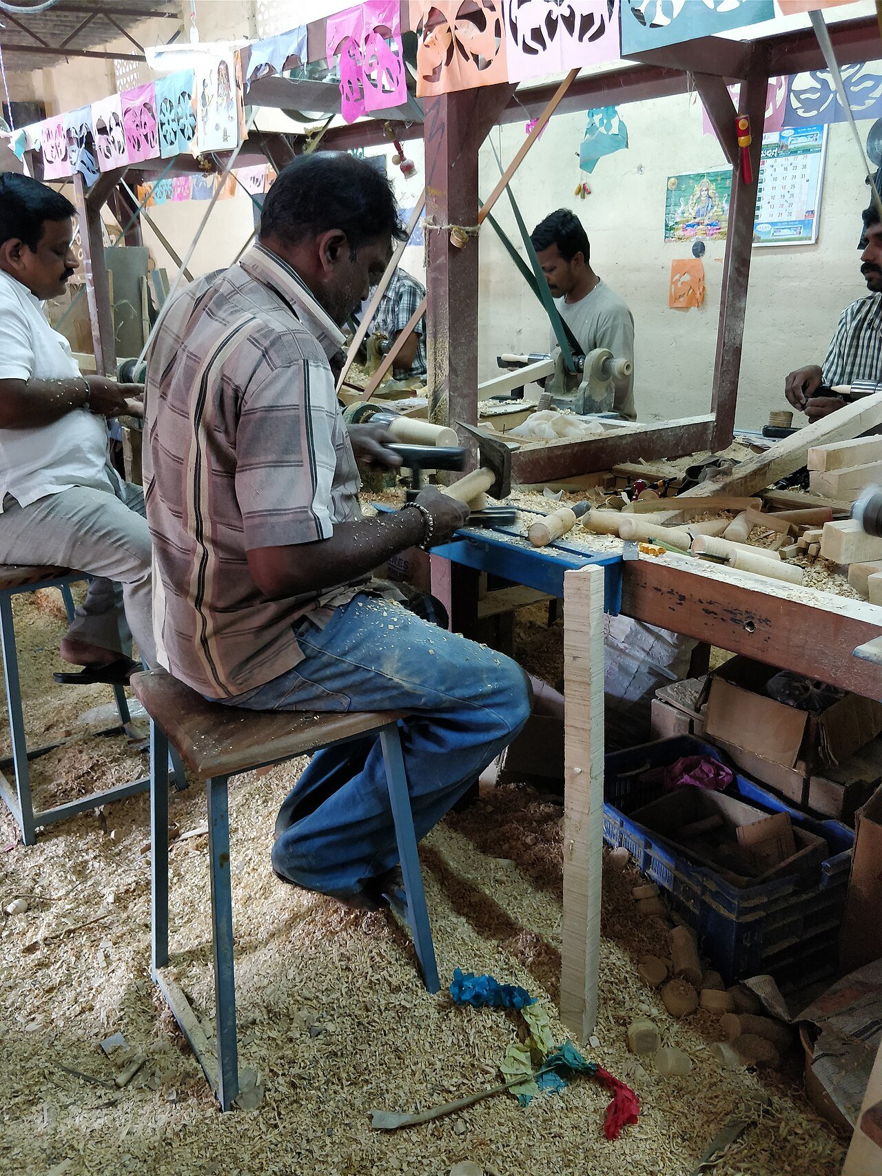 Artisans crafting colourful Channapatna lacquer toys